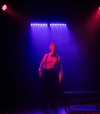 Riles August Holiday as The Hypnotist in An Oak Tree at Greenhouse Theater Center.