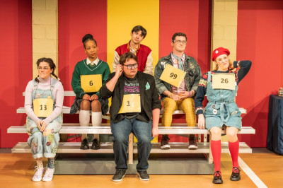 (front, from left) Elizabeth Stenholt plays Olive Ostrovsky, Teddy Gales is William Barfee, Ann Delaney plays Logainne Schwartzandgrubennierein, (back, from left) Shelbi Voss is Marcy Park, Nic Dantes plays Chip Tolentino, and Ben Broughton is Leaf Coneybear in The 25th Annual Putnam County Spelling Bee, part of Paramount Theatre’s BOLD Series. Stephen Schellhardt directs.