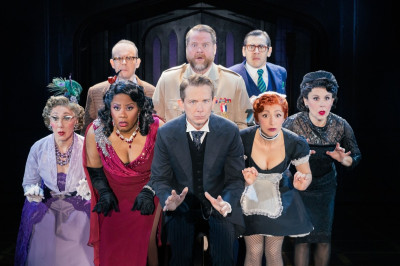 The Company of the North American tour of CLUE.